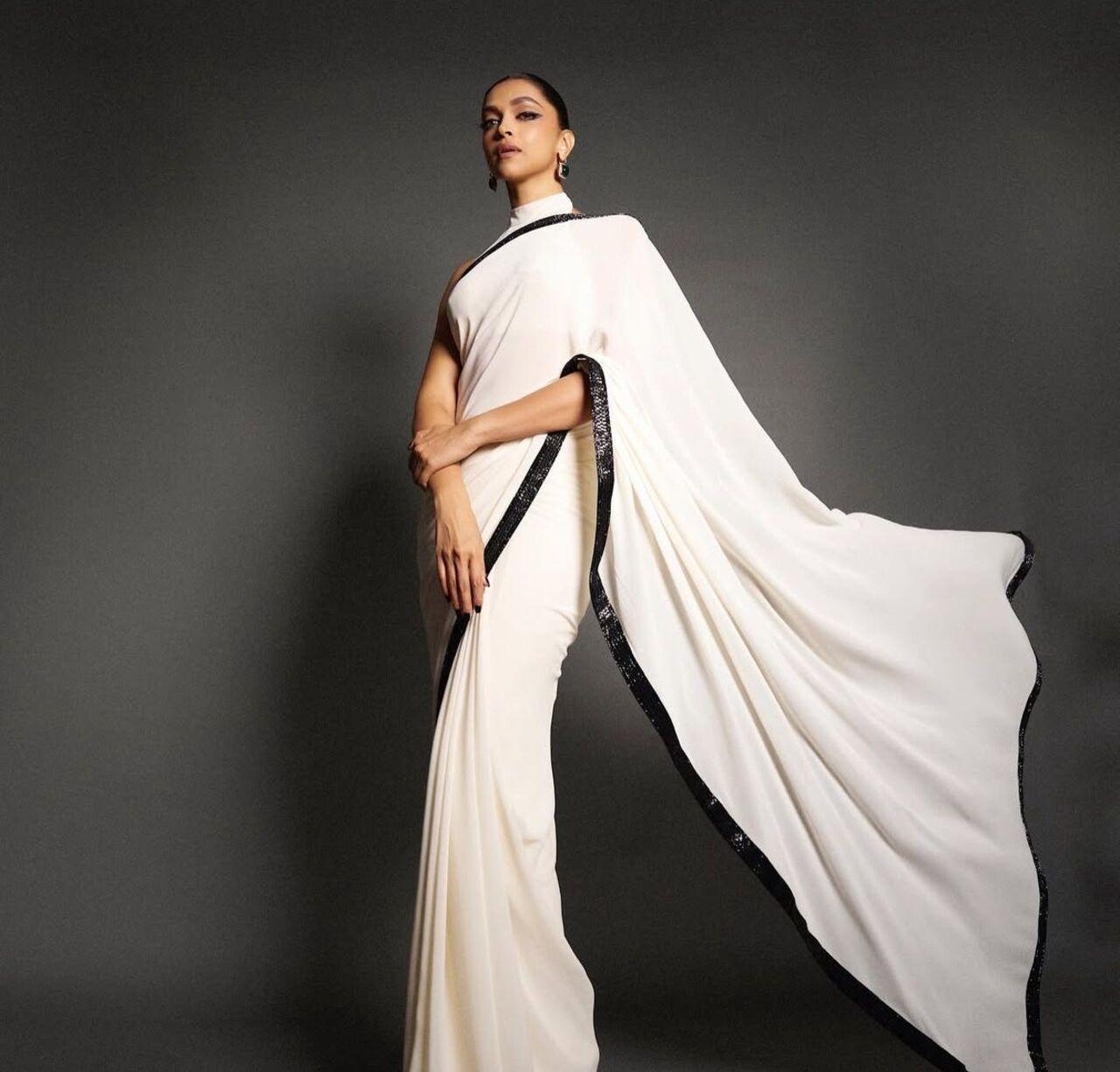 Deepika Padukone’s white attire for Navratri is nothing short of regal. Known for her impeccable fashion sense, she donned a white saree that combined traditional grace with modern cuts. 